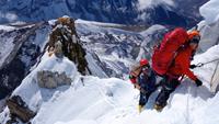 Lakpa Nuru Sherpa on Ama Dablam with C2 in background